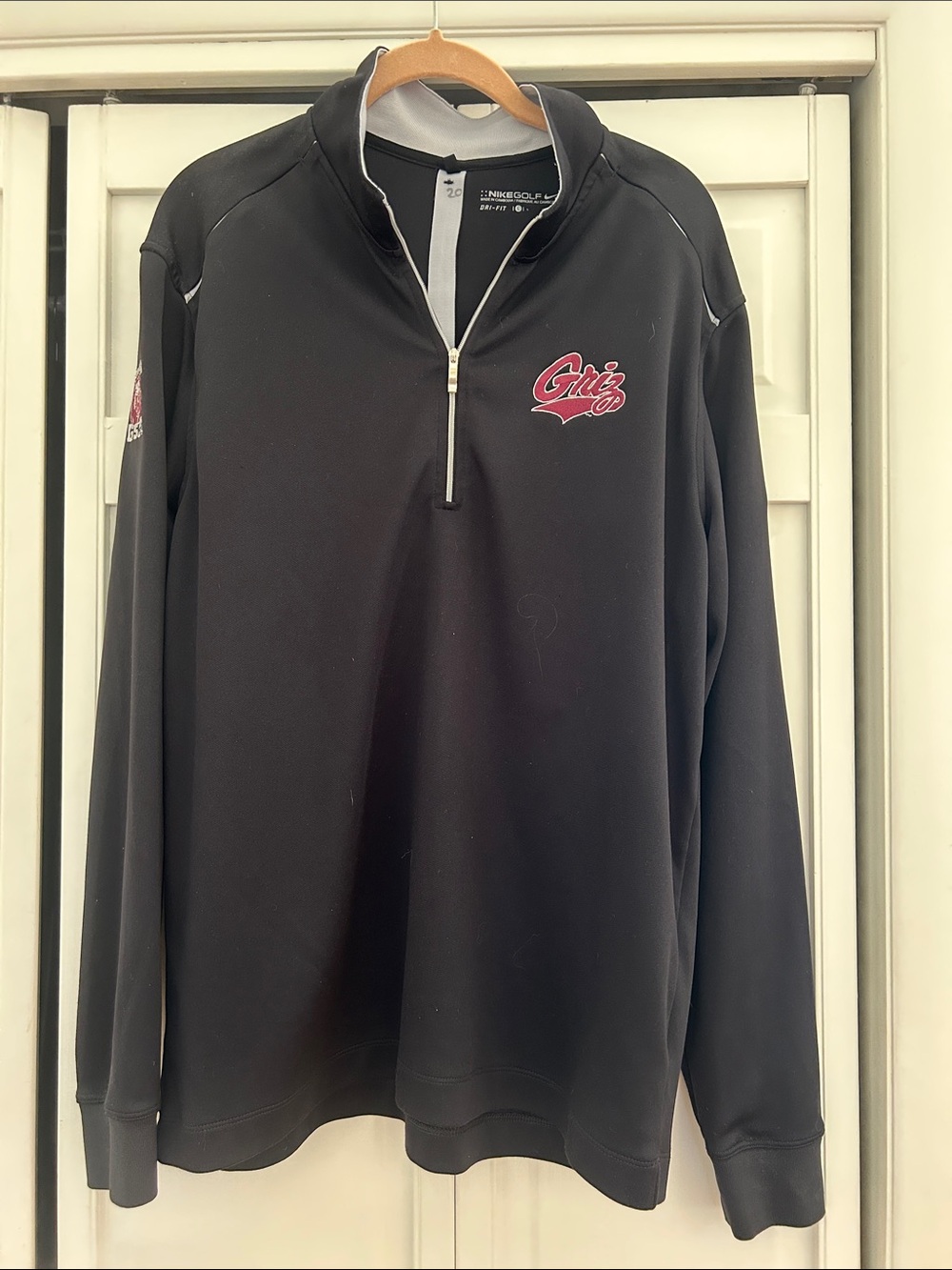 University of Montana Nike Golf Black Quarter-Zip Pullover with maroon Griz Logo